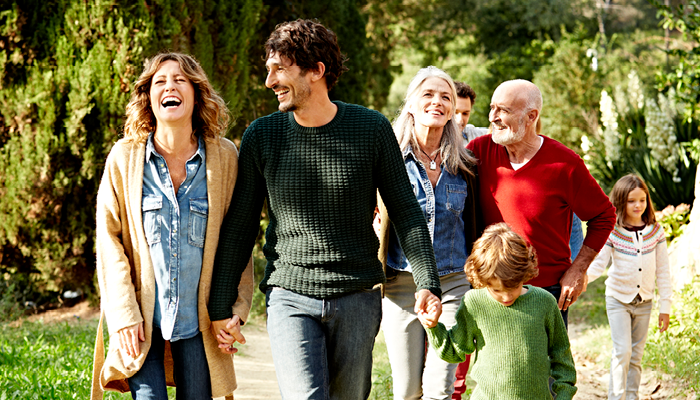 Six happy people walking next to each other