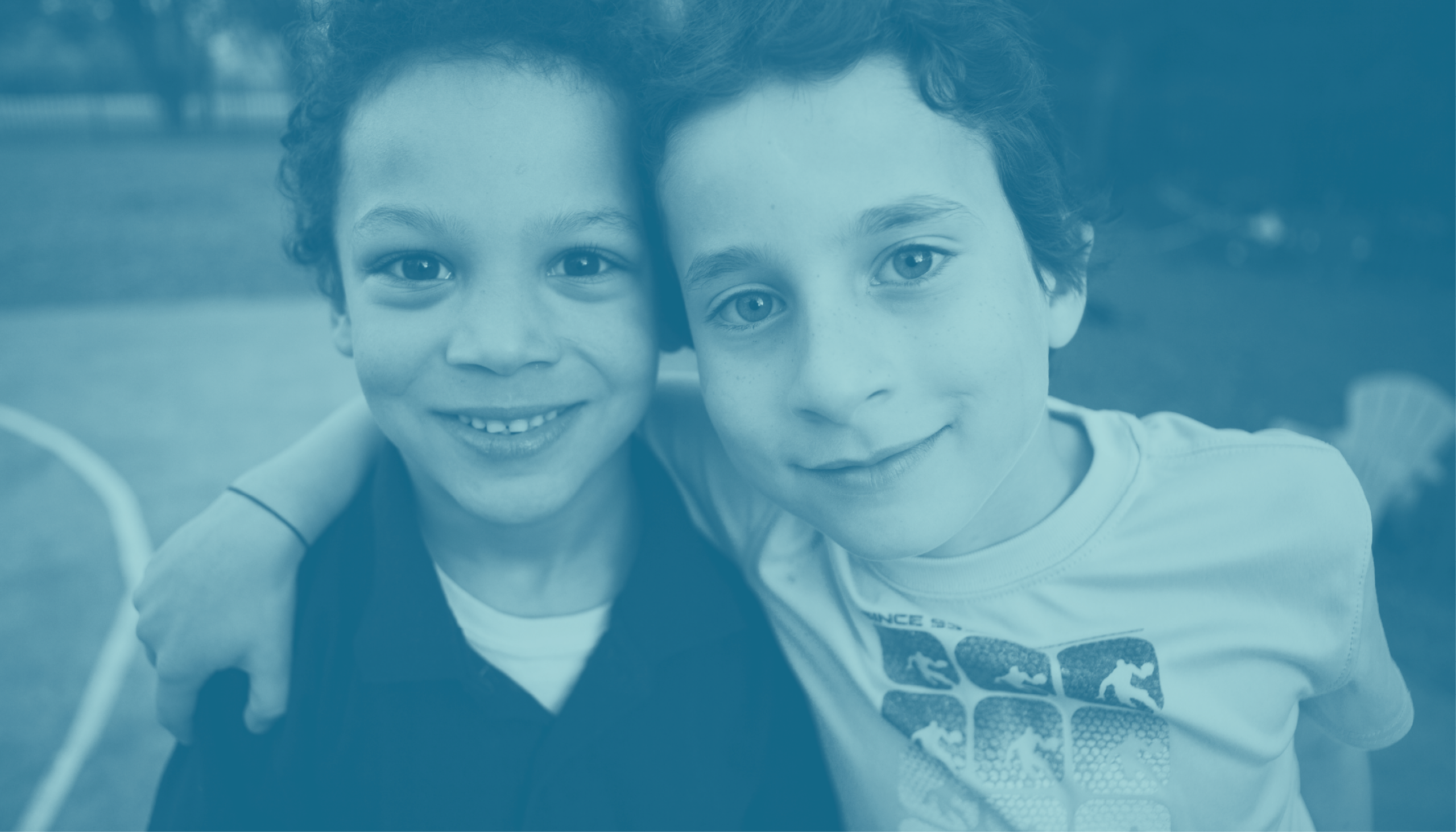 Two young boys smiling