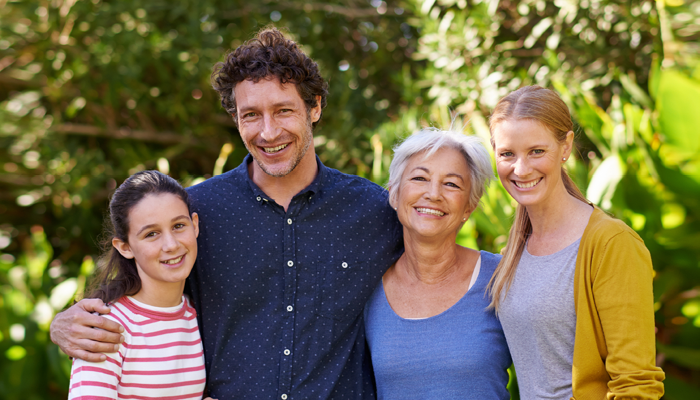 Family of 4 posing for a photo