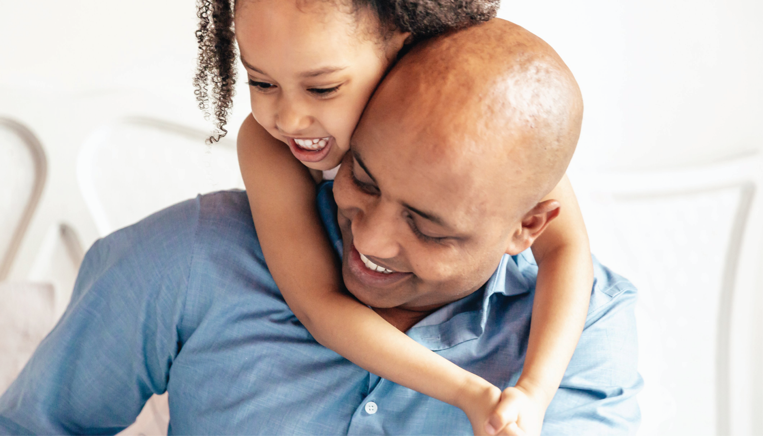 Little girl embracing father