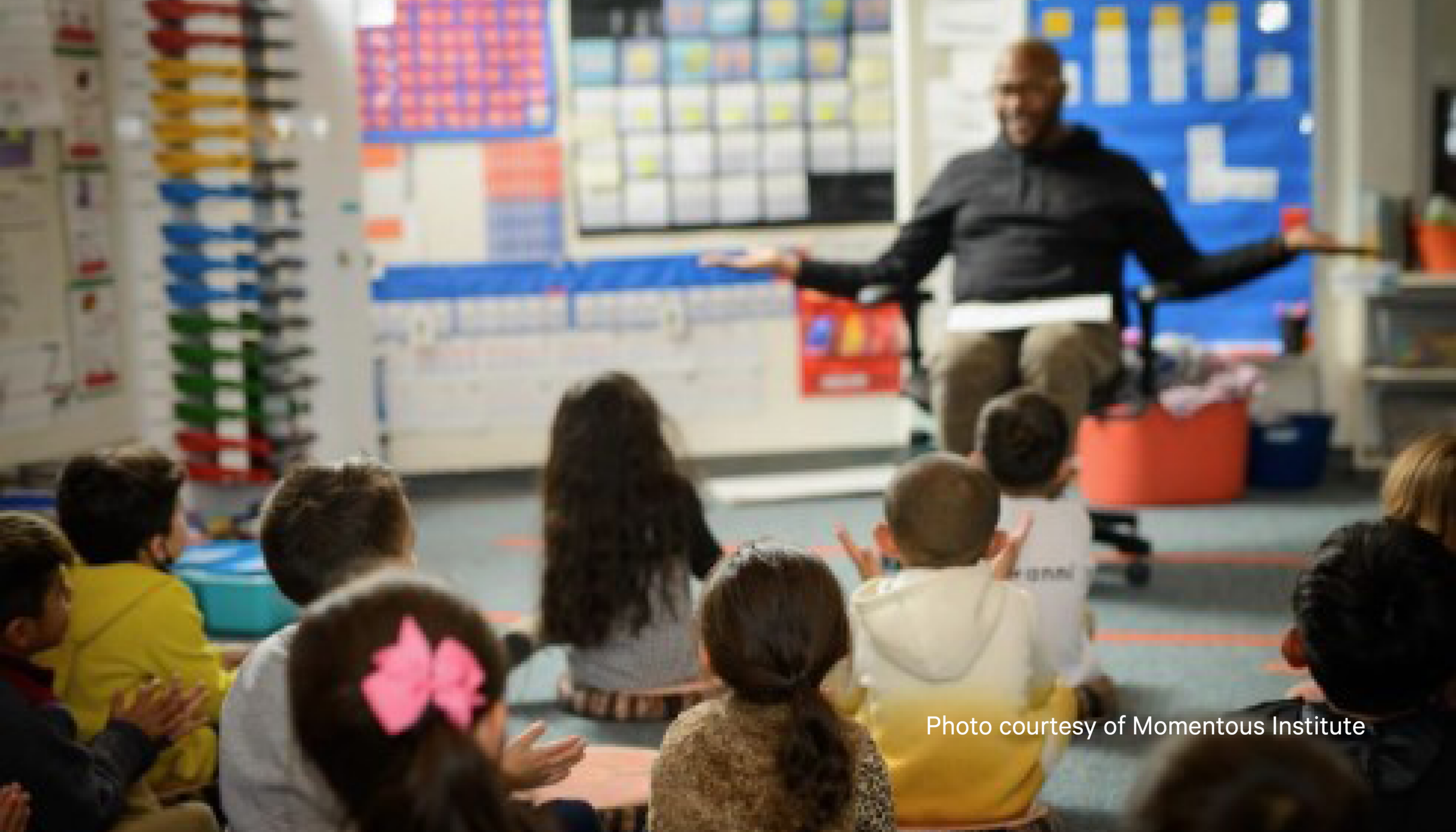 Teacher speaking to classroom of students