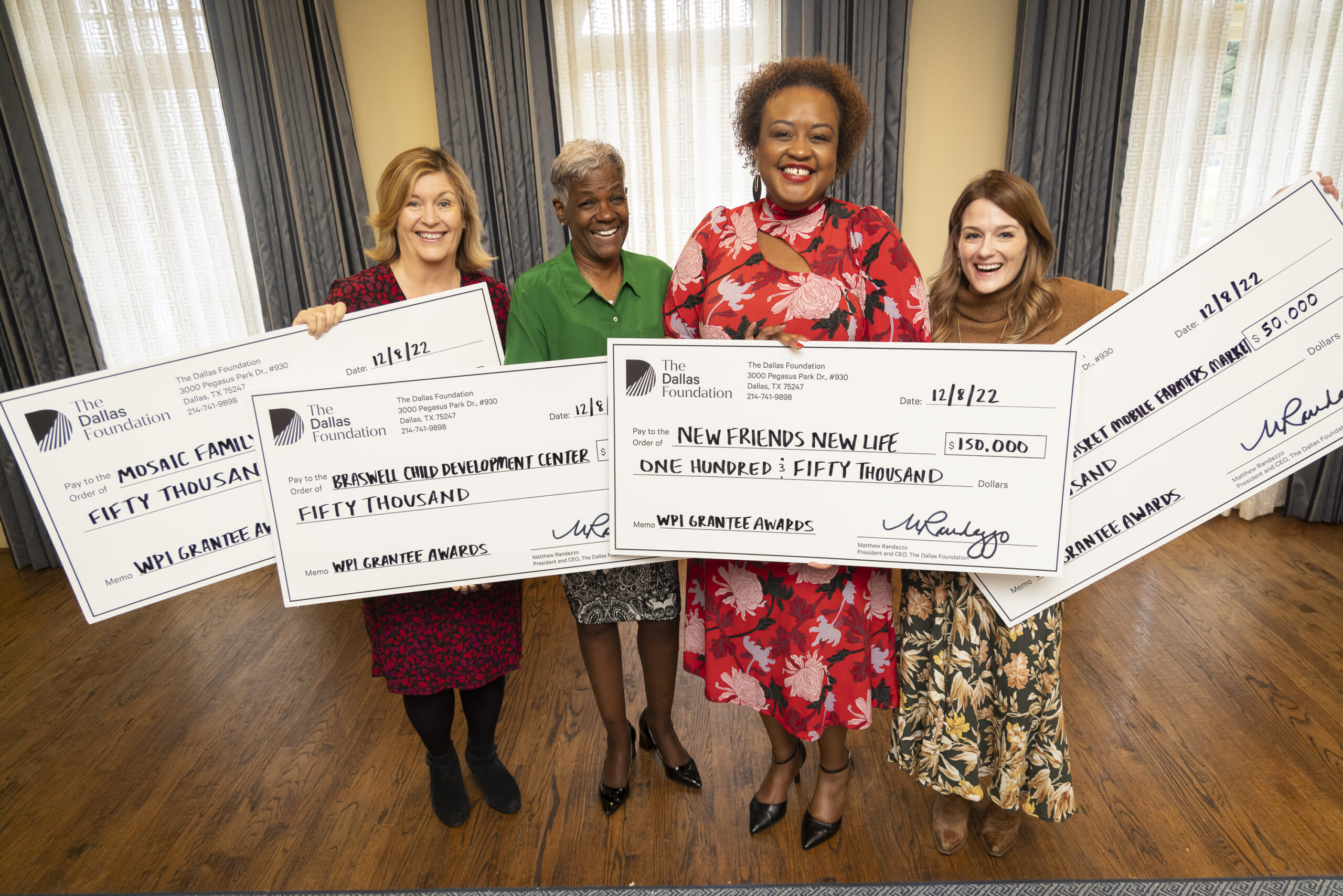 4 grantees holding WPI award checks