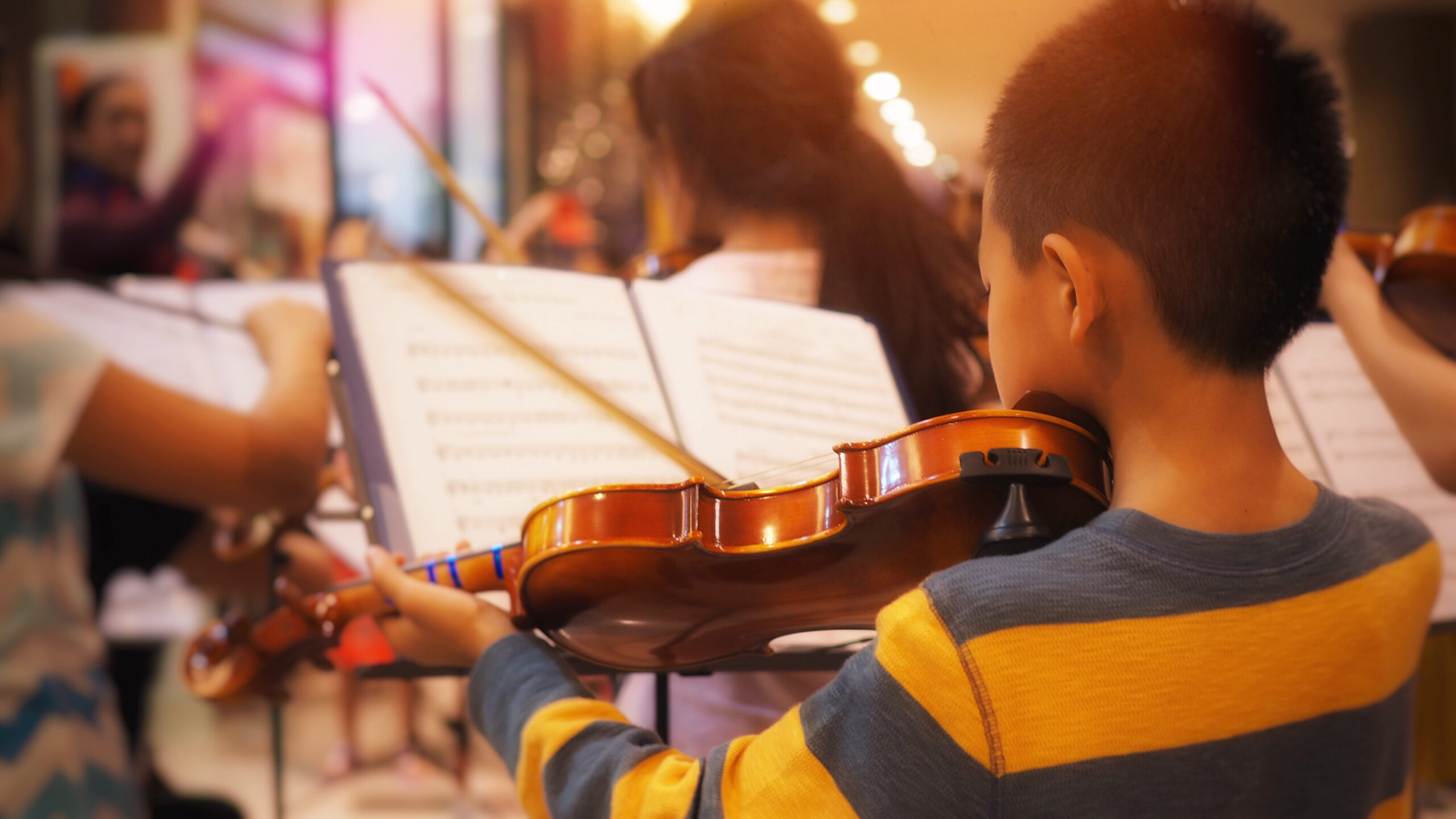 Young boy playing violin