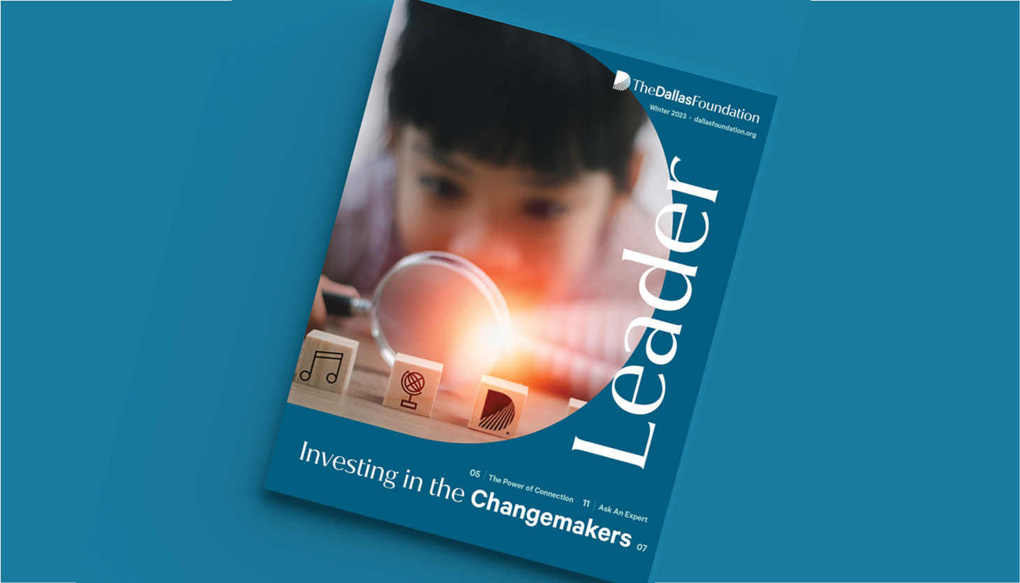 Image of the cover of winter 2023 issue of Leader, themed "Investing in the Changemakers," and featuring a young child holding a magnifying glass.